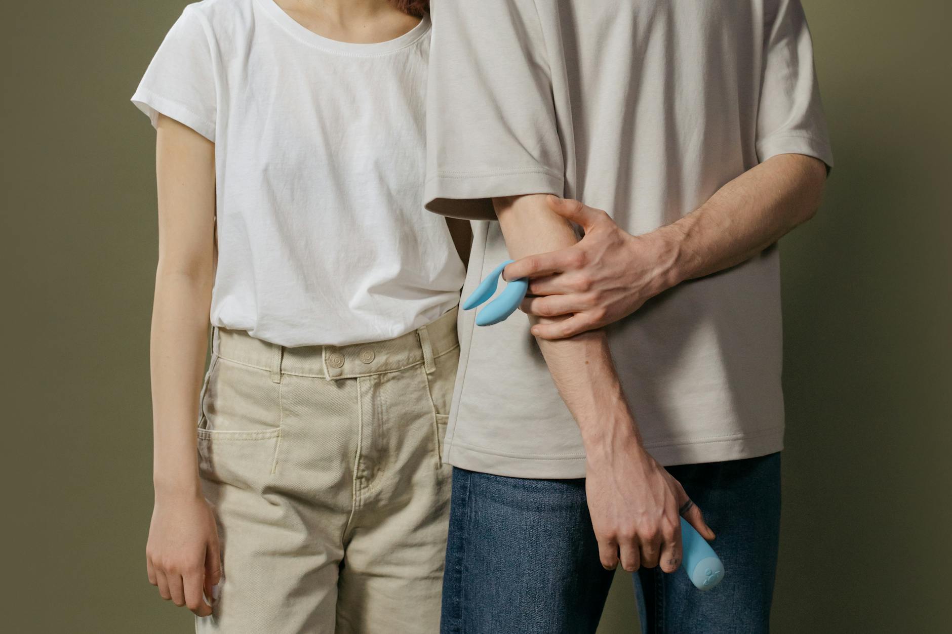 A couple standing together indoors, navigating intimacy and desire mismatch in their relationship.